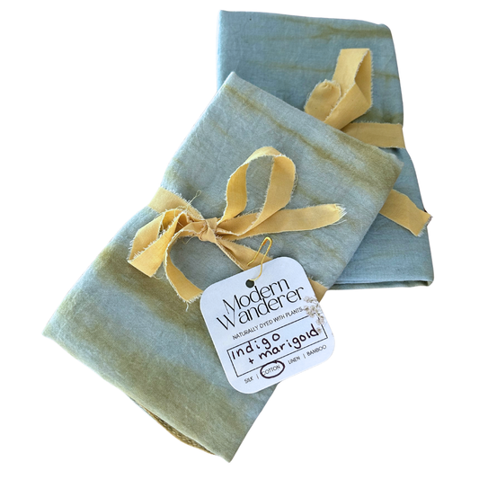 Set of two organic cotton plant dyed bandanas. Blue and green tie dyed pattern. Indigo and marigold.