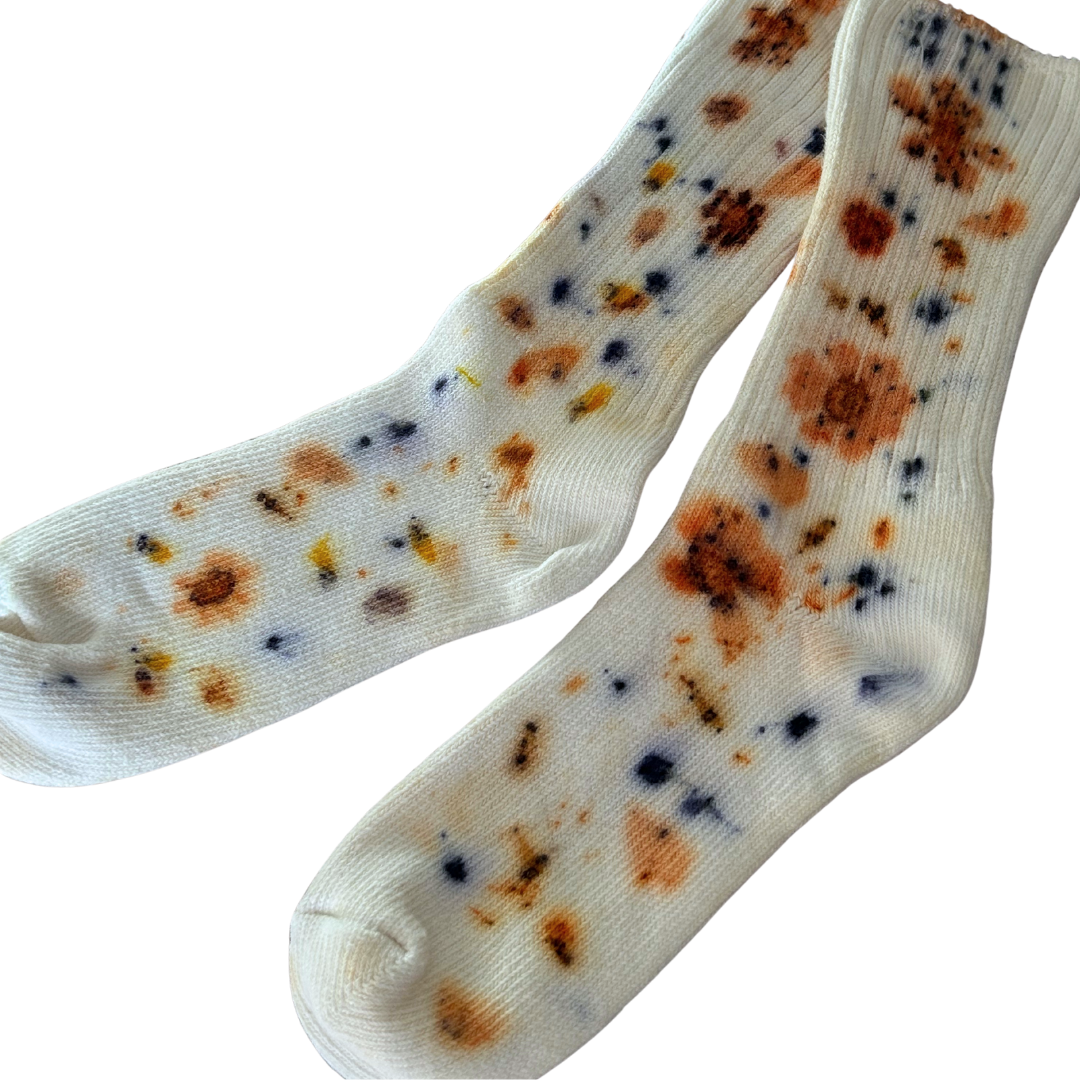 Naturally dyed organic cotton socks.
White socks with garden flowers eco printed on top.