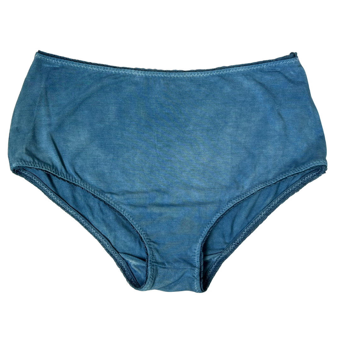 Naturally dyed indigo blue underwear on a white background