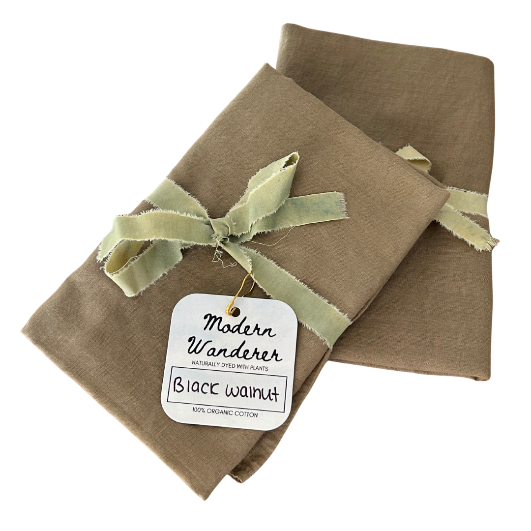 Two brown bandanas, 100% organic cotton dyed naturally with black walnuts.
Plant dyed bandanas.