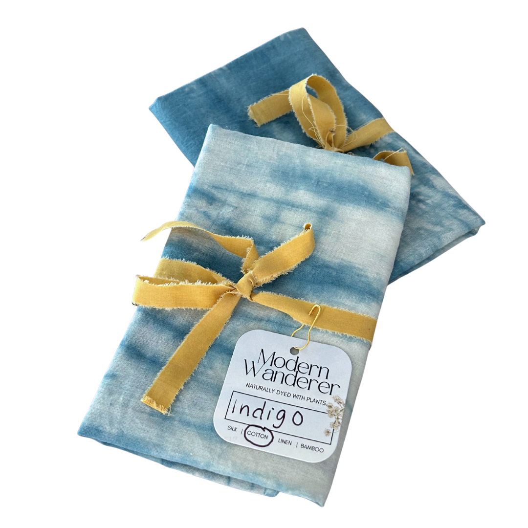 Two tie dyed blue bandanas on a white background.
Plant dyed with indigo. 