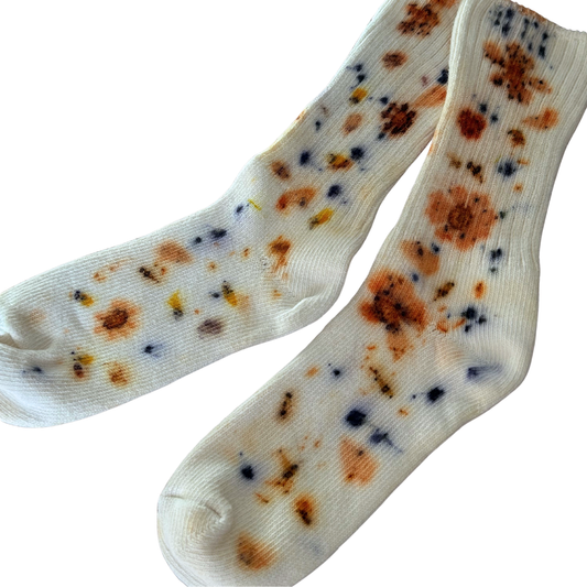 Naturally dyed organic cotton socks.
White socks with garden flowers eco printed on top.